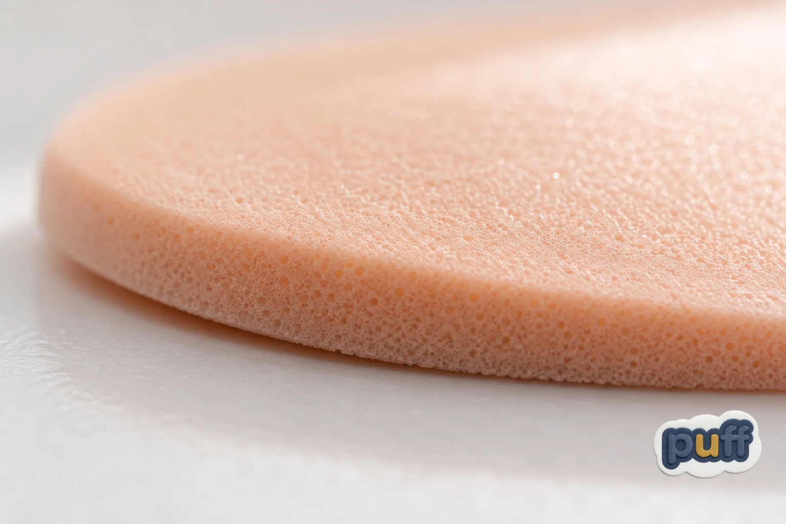 Macro close-up of a foam sticker's rounded edge and soft textured surface catching gentle light