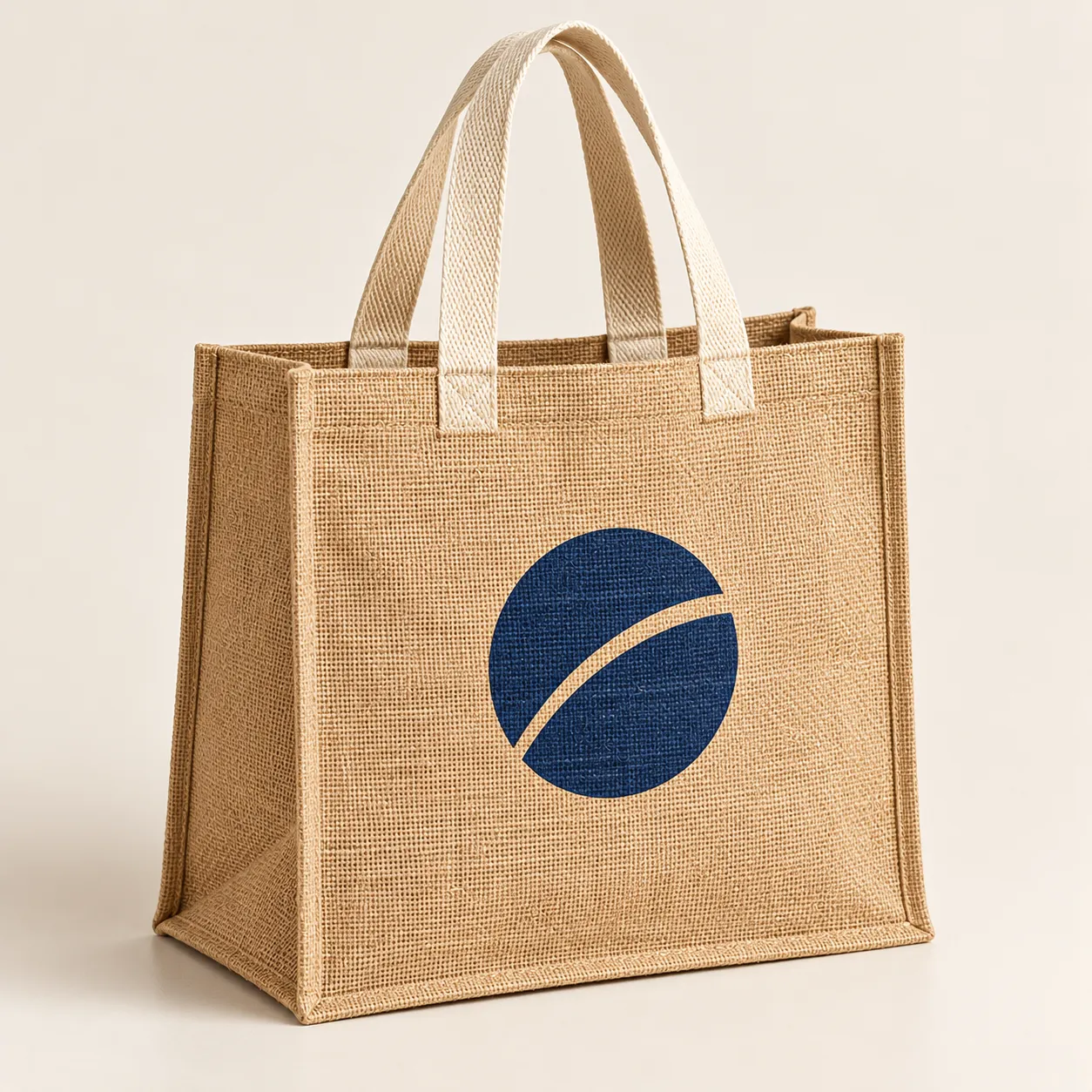 Natural jute tote with cream cotton handles and a navy printed mark