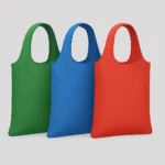 A set of three custom nylon bags in green, blue, and red, crafted from durable, water-repellent polyamide fibers. These lightweight, abrasion-resistant bags are ideal for travel, school, retail, or promotional giveaways, with customizable logos and designs. Offered by PuffSticker.com with fast delivery and quality assurance.