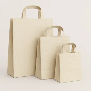 A set of three washable paper bags in white color in different sizes, crafted from eco-friendly, cellulose-reinforced, water-resistant paper. These durable, vegan-friendly bags feature sturdy handles and a leather-like texture, ideal for shopping or gifting. Customizable with brand logos, they are offered by PuffSticker.com with global delivery options.
