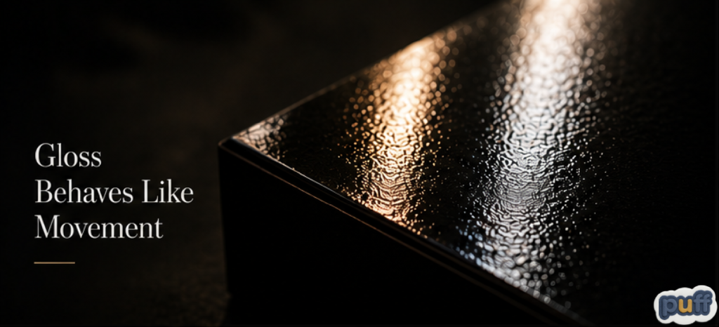 Glossy packaging surface reflecting light, illustrating gloss psychology, reflective packaging design, visual stimulation, consumer attention, and emotional perception.